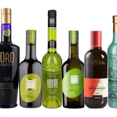 Varias botellas de aceite de oliva virgen extra, mostrando el **aceite de oliva origen** de diferentes regiones y variedades.