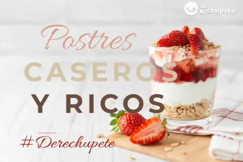 Vaso de postre de fresa y yogur con granola, junto a fresas frescas.