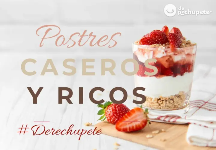 Vaso de postre de fresa y yogur con granola, junto a fresas frescas.