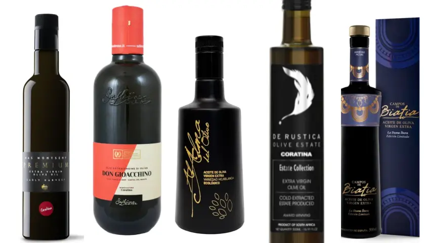 Varias botellas de aceite de oliva virgen extra, incluyendo aceitunas para aceite de Coratina, con etiquetas elegantes y distintivas.